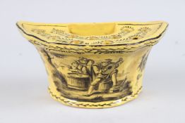 AN 18TH CENTURY FRENCH YELLOW GLAZED CROCUS POT painted with figures. 8ins wide