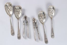 A SET OF FOUR VICTORIAN SILVER BERRY SPOONS, Sheffield 1860, maker Martin Hall, together with a pair