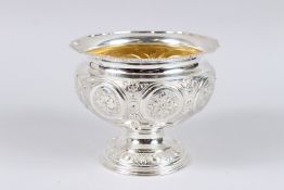 AN EDWARD VII SILVER PEDESTAL BOWL, with flower head embossed decoration, Sheffield 1902, maker