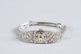 A LADIES PLATINUM AND DIAMOND SET COCKTAIL WRISTWATCH.
