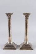 A PAIR OF OCTAGONAL SILVER CANDLESTICKS on stepped bases. 10.5ins high. London 1915.