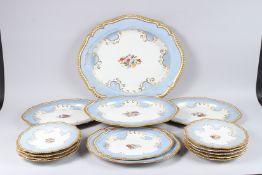 A WORCESTER PORCELAIN PART DINNER SERVICE, of shaped outline with blue and gilt decorated borders,
