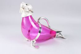 A CRANBERRY COLOURED WALRUS CLARET JUG, with plated mounts, 13in long.