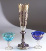 A TALL BOHEMIAN GLASS VASE with blue and gilt panels. 12ins high and A SMALL PAIR OF BOWLS. 4ins