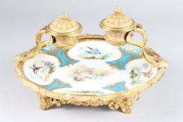 A GOOD SEVRES PORCELAIN ORMOLU MOUNTED INK WELL painted with birds.