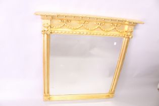 A RECTANGULAR GILTWOOD OVER-MANTEL MIRROR, with ribbon and bow frieze, column sides, 3ft 11in high x