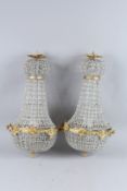 A GOOD PAIR OF BRASS AND GLASS EMPIRE CHANDELIERS.