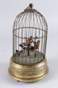 TWO BIRDS IN A GILDED CAGE. 11ins high x 5.5ins diameter.