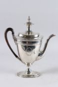 A GEORGE III SILVER TEA POT AND COVER BY JOHN EAMES with pineapple finial and wooden handle.