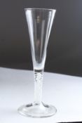 A GEORGIAN TAPERING WINE GLASS with large bowl and white air twist stem. 8ins high.