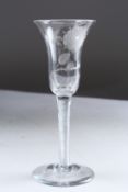 A JACOBITE WINE GLASS, the bowl engraved with roses. 7ins high