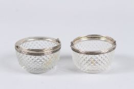 A PAIR OF WHITE METAL MOUNTED HOBNAIL CUT SMALL DISHES, with swing handles, 2¾in diameter.