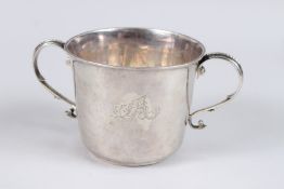 A GEORGE I LARGE SILVER PORRINGER, with scroll handles, the body engraved with two sets of initials,