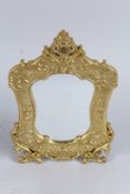 A GILT BRONZE EASEL MIRROR. 12ins high.