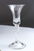 A GEORGIAN WINE GLASS with air twist and knop stem. 7ins high.