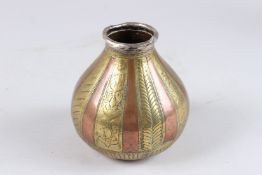 AN 18TH CENTURY SOUTH INDIAN TANJORE GANGA JUMNA COPPER AND BRASS POT with silver rim.