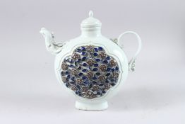 A CHINESE UNDERGLAZE RED AND BLUE DECORATED PORCELAIN EWER AND COVER, with phoenix spout, 10½ high.