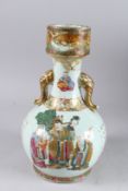 A 19TH CENTURY CHINESE FAMILLE ROSE BULBOUS SHAPE PORCELAIN VASE, with elephant head handles,