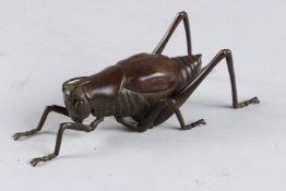 A BRONZE OKIMONO OF A GRASSHOPPER, 6½in long.