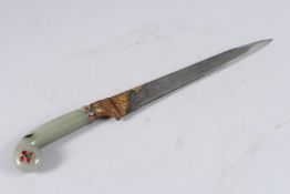 AN INDIAN DAGGER with partially gilded tapering blade and hilt, the green hardstone handle inset