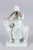 A 19TH/20TH CENTURY CHINESE BLANC DE CHINE PORCELAIN GROUP OF A MAN ON HORSEBACK, 11½in high.