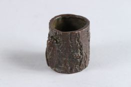 A BRONZE OKIMONO OF A CICADA ON A TREE TRUNK, 1¾in high.