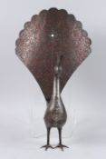 A FINE AND LARGE 19TH CENTURY PERSIAN QAJAR SILVER AND GOLD INLAID STEEL PEACOCK with open worked