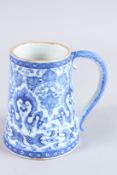 A TURKISH OTTOMAN IZNIK BLUE AND WHITE MUG. 6ins high.