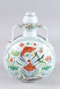 A CHINESE WUCAI TWIN HANDLED MOON FLASK, painted with fish, 11½in high.
