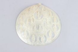A FINELY CARVED EARLY 19TH CENTURY PALESTINIAN JERUSALEM MOTHER-OF-PEARL SHELL depicting religious
