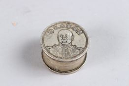 A SMALL CHINESE WHITE METAL CIRCULAR INK POT AND COVER. 1.5ins diameter.