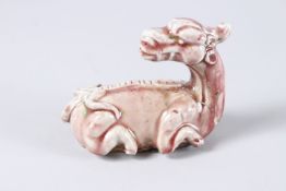 A CHINESE UNDERGLAZED BEAST. 4.5ins.