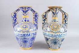 A PAIR OF 19TH CENTURY ISLAMIC ALHAMBRA VASES, with blue and yellow painted bodies in a stylised