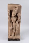 A VERY FINE AND LARGE INDIAN CARVED STONE FIGURE OF A DEITY on a stand. 24ins high.
