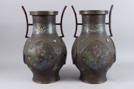 A PAIR OF 19TH CENTURY JAPANESE BRONZE AND ENAMEL TWIN HANDLED VASES, enamel decoration to the