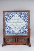 A 20TH CENTURY CHINESE BLUE AND WHITE PORCELAIN SCREEN ON HARDWOOD STAND the panel fitted with