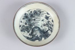 A RARE 17TH CENTURY PERSIAN SAFAVID GLAZED POTTERY DISH. 8.75ins diameter.