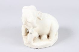 A 17TH - 18TH MUGHAL INDIAN CARVED WHITE MARBLE SEATED ELEPHANT, possibly a carpet weight. 6ins