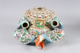 THE BASE OF A 19TH CENTURY CHINESE SEATED NODDING FIGURE, painted all over with a floral design, the