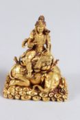 A SMALL GILT METAL FIGURE OF SAMATABHADRA BODHISATTVA. 3.5ins high.