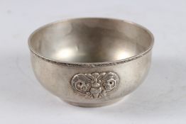 A CHINESE WHITE METAL CIRCULAR BOWL, with butterfly mounts, 4¾in diameter.