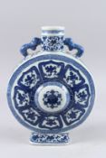 A CHINESE BLUE AND WHITE PORCELAIN MOON FLASK painted with a stylised design, seal mark to base.