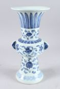 A CHINESE BLUE AND WHITE GU SHAPE VASE, painted with flowers, 13¼in high.