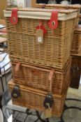 Three wicker hampers.