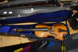 Alfred Moritz, a cased violin.