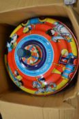 A Chad Valley tin plate spinning top with original box.