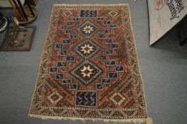 A small Persian style rug, 138cm x 100cm.