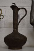 A good Islamic ewer with chased decoration.