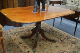 A mahogany and satinwood banded tilt-top breakfast table.