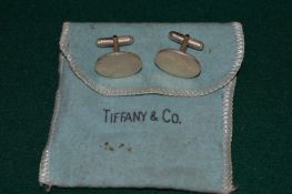 A pair of Tiffany & Co silver oval shaped cufflinks.